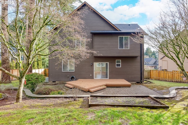 back of property featuring a yard and a deck