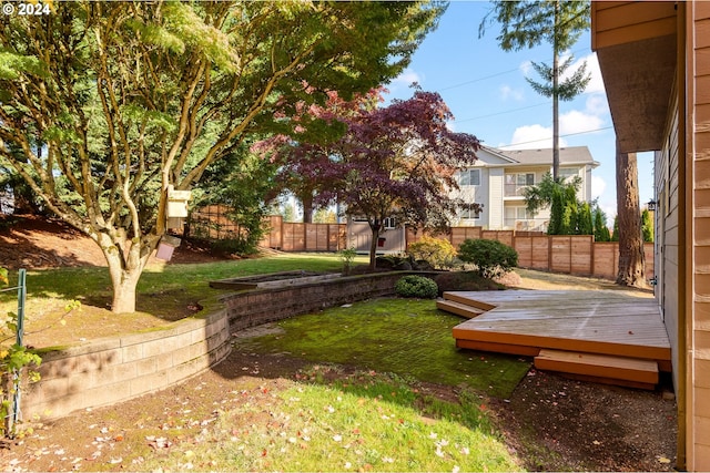 view of yard featuring a wooden deck