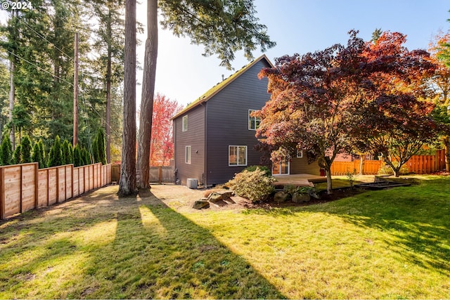 exterior space featuring a yard and central AC unit