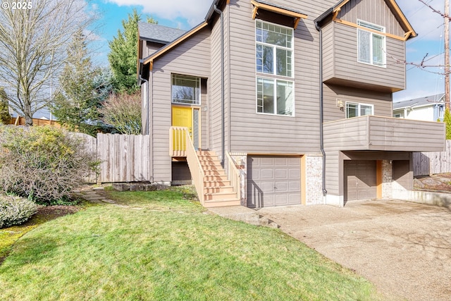 view of front of house with a garage and a front yard