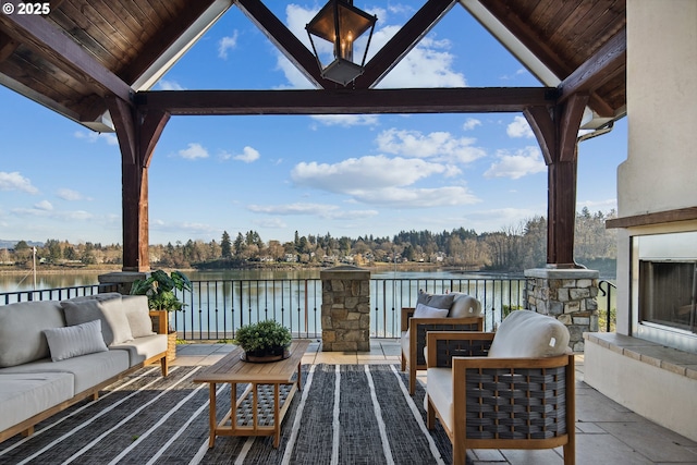 view of patio / terrace featuring a water view and outdoor lounge area