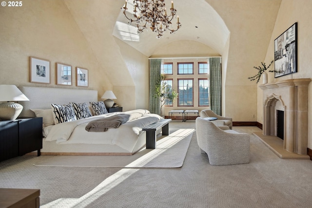 bedroom featuring a high ceiling, light colored carpet, and an inviting chandelier