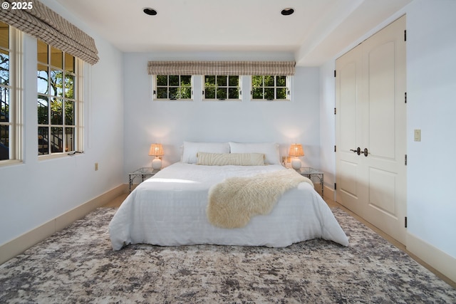 bedroom featuring multiple windows