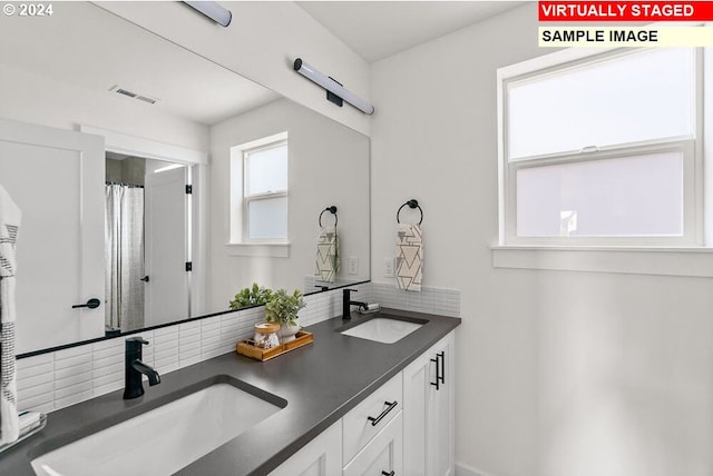 bathroom with backsplash and vanity