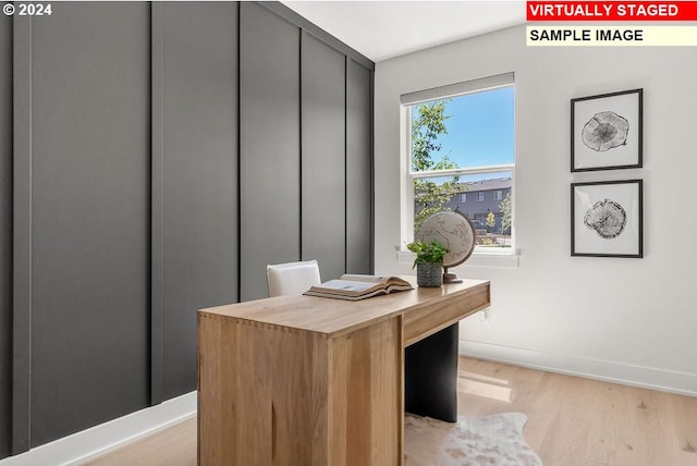 office area with light hardwood / wood-style floors