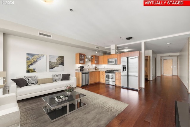 living room with dark wood-type flooring