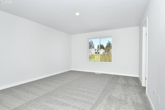 empty room with carpet flooring