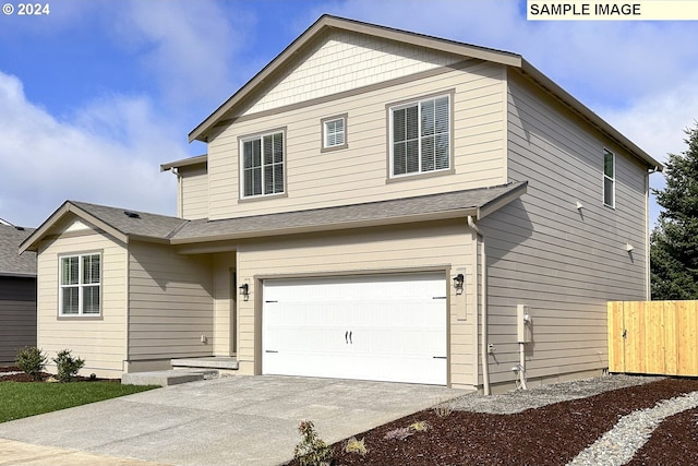 view of front of property with a garage