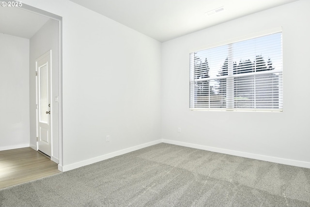 spare room featuring carpet flooring