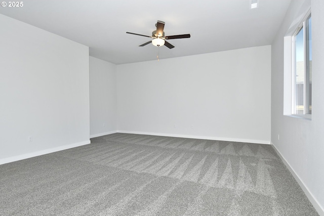 carpeted empty room featuring ceiling fan