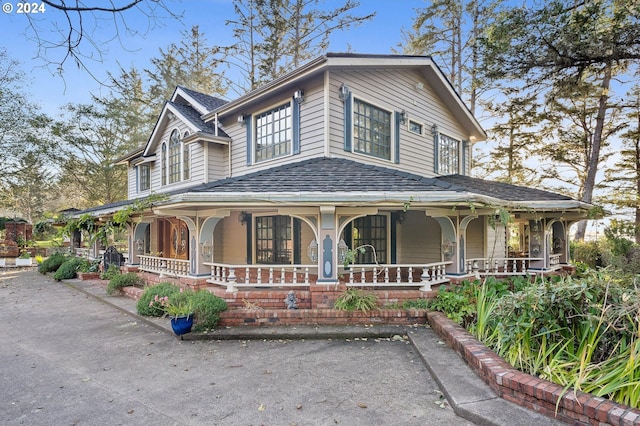 view of front of property featuring covered porch