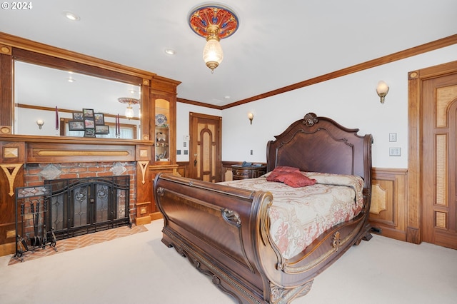 bedroom with light carpet, a fireplace, and crown molding