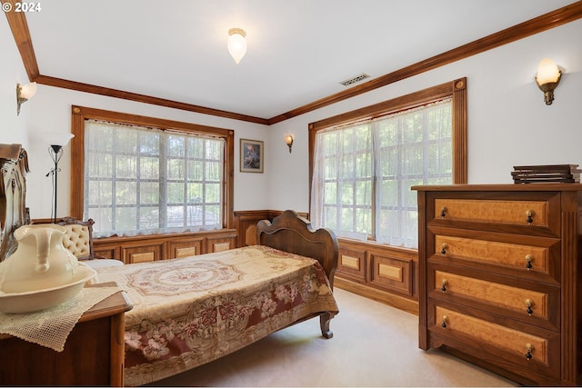 carpeted bedroom with crown molding