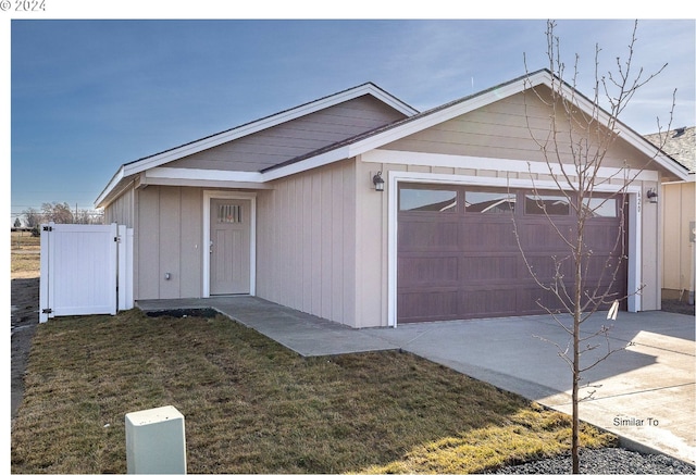 single story home featuring a front lawn and a garage