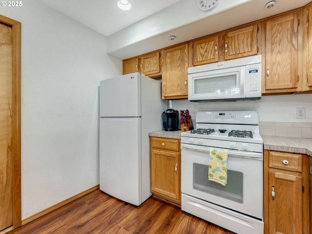 4196 SE Pinehurst Ave, Milwaukie, OR 97267 - kitchen with white appliances, light countertops, dark wood-style floors, and baseboards