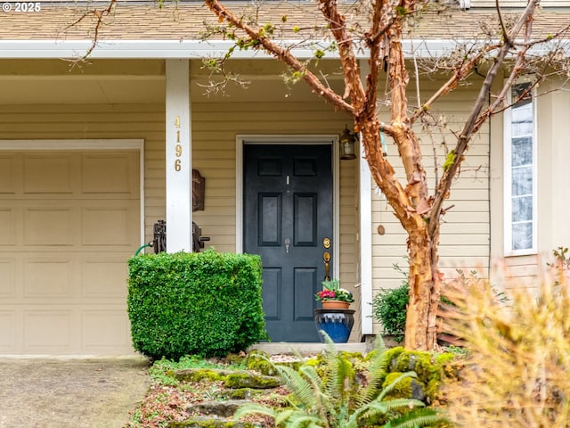 property entrance with a garage