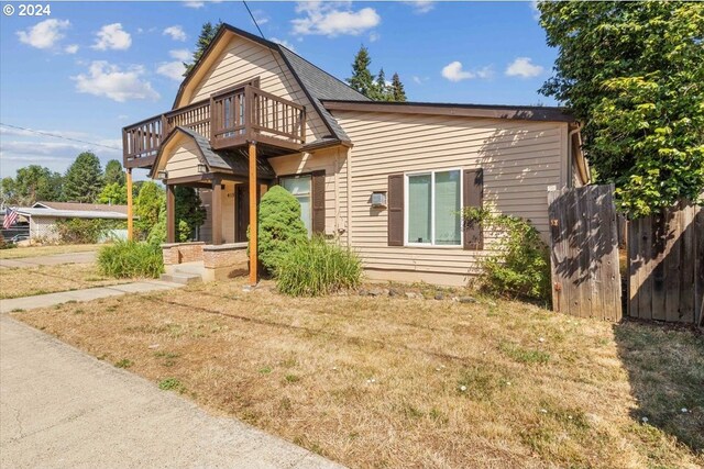 view of property featuring a front lawn