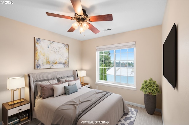 bedroom featuring carpet floors, visible vents, baseboards, and ceiling fan