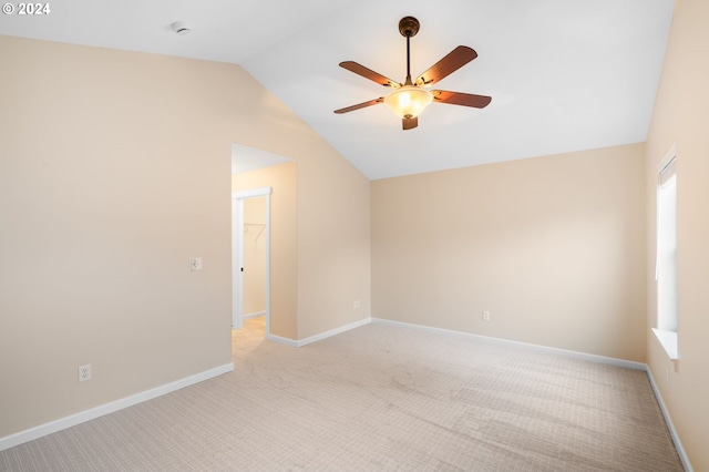 unfurnished room featuring light carpet, ceiling fan, and lofted ceiling