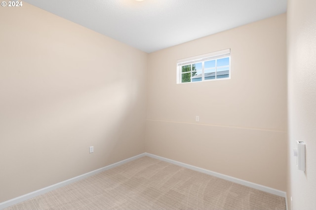 empty room with light colored carpet