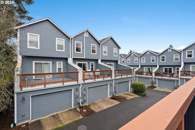 view of front of property with a garage and a residential view