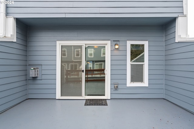 entrance to property with a patio area