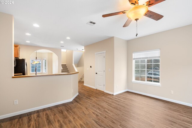 5171 SW 174th Ter, Beaverton, OR 97078 - unfurnished room featuring wood finished floors, recessed lighting, baseboards, a ceiling fan, and arched walkways