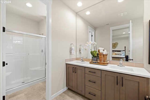 bathroom with vanity and walk in shower