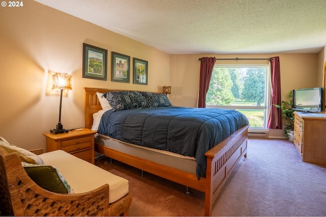 carpeted bedroom featuring a textured ceiling