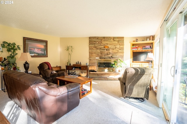 carpeted living room with a fireplace and a textured ceiling