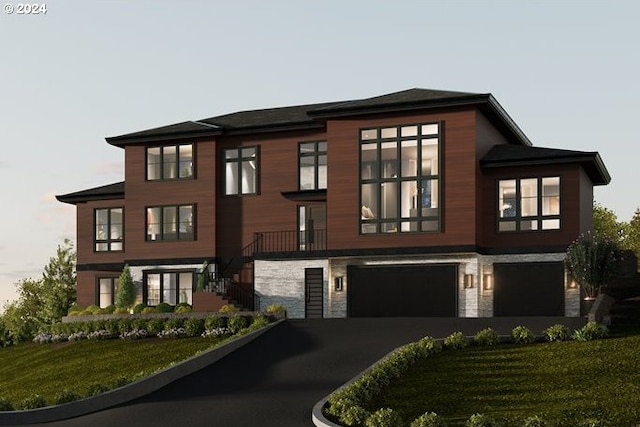 view of front facade featuring a garage and a front yard