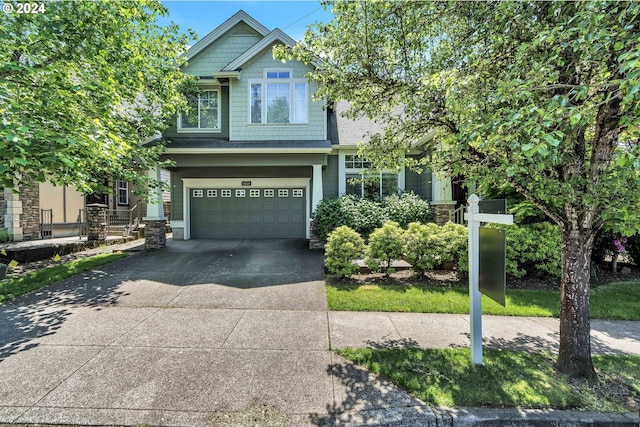 craftsman-style house featuring a garage