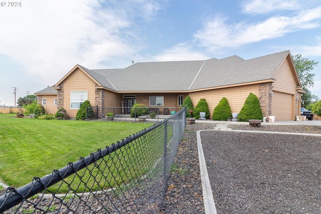 single story home with a garage and a front yard