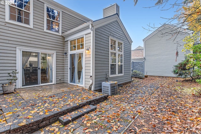 back of house with a patio and central AC unit