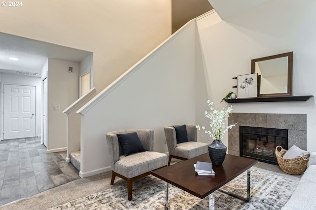 living room featuring wood-type flooring and a fireplace