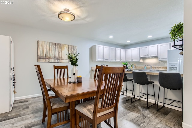 dining area featuring hardwood / wood-style floors