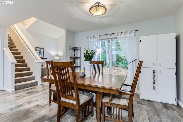 dining room with hardwood / wood-style floors