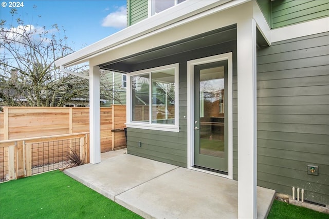 entrance to property with a patio area