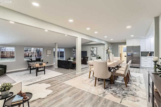 dining area with light hardwood / wood-style floors