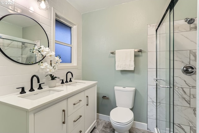 bathroom featuring vanity, toilet, and a shower with door