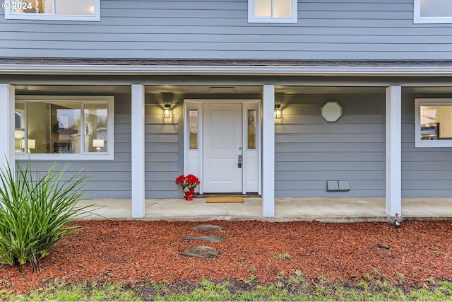 entrance to property featuring a porch