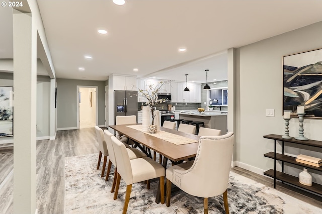 dining room with light hardwood / wood-style floors