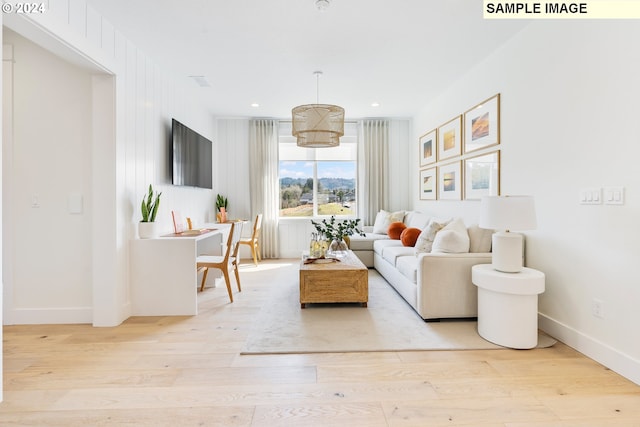 living room with light hardwood / wood-style flooring