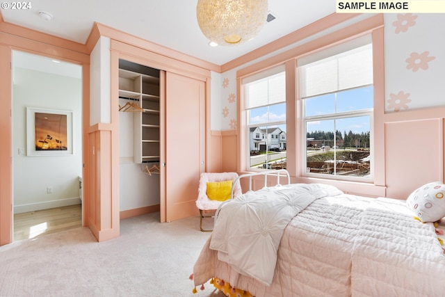 carpeted bedroom featuring a closet