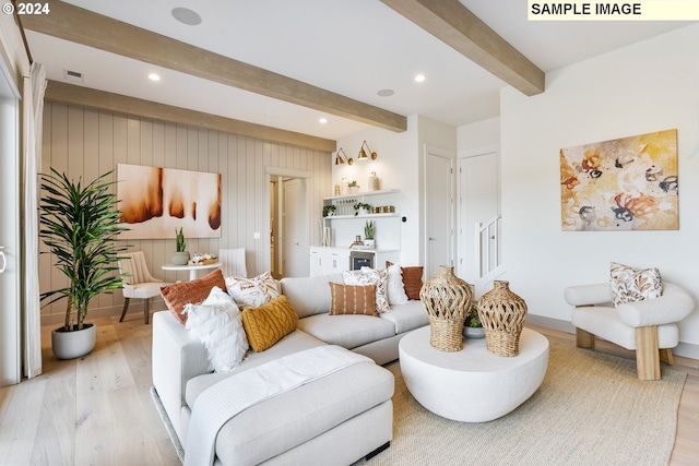 living room with beam ceiling and light wood-type flooring