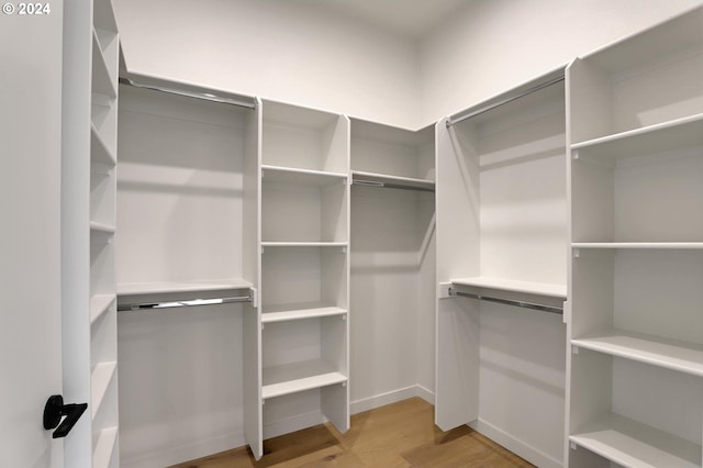 walk in closet featuring light hardwood / wood-style floors