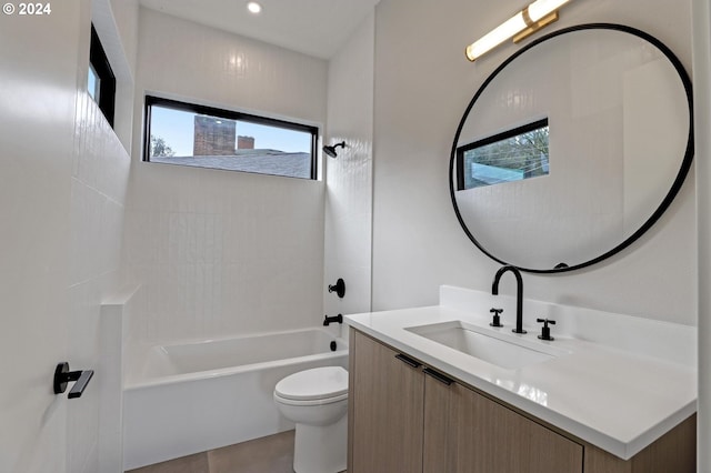 full bathroom with tiled shower / bath, tile patterned flooring, vanity, and toilet