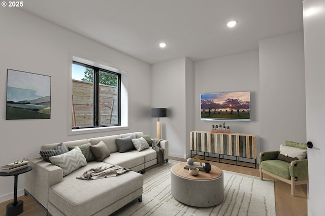 living room with baseboards, wood finished floors, and recessed lighting