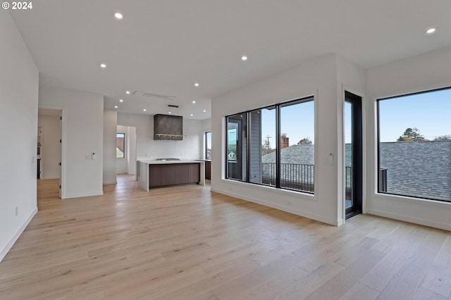 unfurnished living room with light hardwood / wood-style flooring