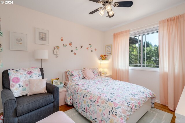 bedroom featuring ceiling fan and light hardwood / wood-style flooring